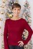 A woman wearing a long-sleeve ribbed knit boat neck sweater in deep red.