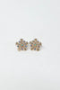 A pair of gold snowflake-shaped stud earrings embellished with small blue and green rhinestones.