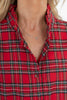 Close-up of a woman wearing a red plaid button-up shirt with thin black and white stripes.