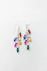 A pair of silver-toned dangle earrings with multiple colorful marquise and oval gemstones in red, blue, yellow, pink, and green.