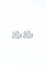 A pair of small silver ghost-shaped stud earrings with white enamel fill, shown on a plain white background.