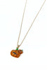 A gold chain necklace featuring a glittery orange pumpkin pendant with a carved face and a small matching pumpkin charm, shown on a plain white background.