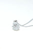 A cute white ghost pendant necklace with a silver chain, photographed on a seamless white background.